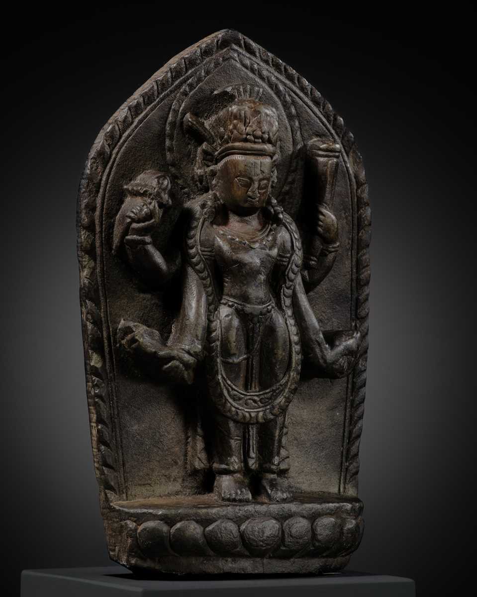 Lot 10 - A STONE STELE OF VISHNU, LATE MALLA, THREE KINGDOMS PERIOD