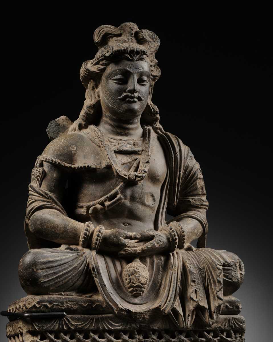 Lot 190 - A GRAY SCHIST FIGURE OF MAITREYA, ANCIENT