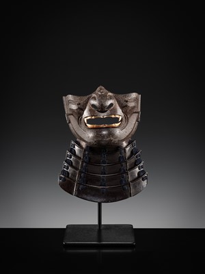 Lot 88 - A LACQUERED IRON ‘FANGED’ RESSEI MENPO