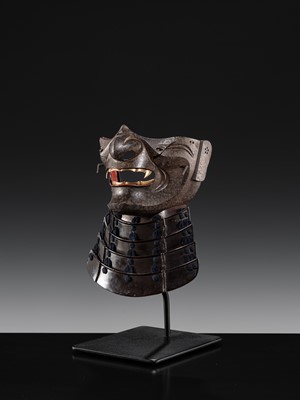 Lot 88 - A LACQUERED IRON ‘FANGED’ RESSEI MENPO