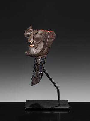 Lot 88 - A LACQUERED IRON ‘FANGED’ RESSEI MENPO