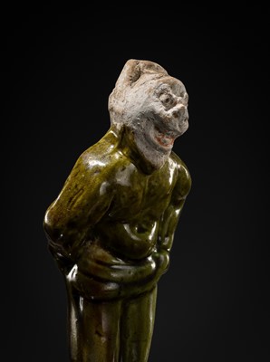 Lot 1078 - A SMALL SANCAI-GLAZED POTTERY FIGURE OF A FOREIGNER, TANG DYNASTY