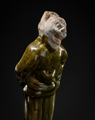 Lot 1078 - A SMALL SANCAI-GLAZED POTTERY FIGURE OF A FOREIGNER, TANG DYNASTY