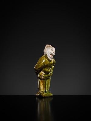 Lot 1078 - A SMALL SANCAI-GLAZED POTTERY FIGURE OF A FOREIGNER, TANG DYNASTY