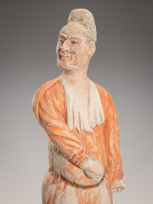 Lot 1080 - A PAINTED POTTERY FIGURE OF A GROOM, TANG DYNASTY