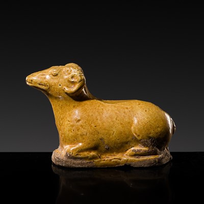 Lot 243 - A RARE MINIATURE AMBER-GLAZED EARTHENWARE FIGURE OF A RAM, TANG DYNASTY