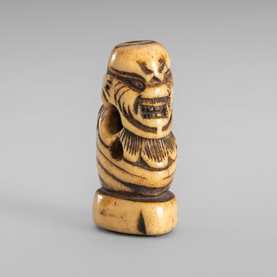 Lot 458 - A RARE ANTLER ‘SILK SEAL’ NETSUKE OF A FOREIGNER