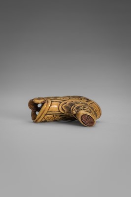 Lot 459 - A FINE ANTLER ‘SILK SEAL’ NETSUKE OF A FOREIGNER