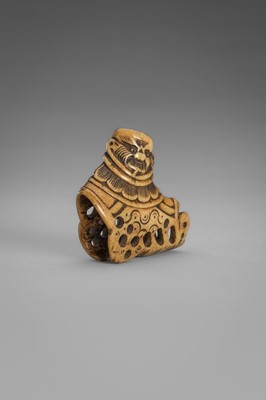 Lot 459 - A FINE ANTLER ‘SILK SEAL’ NETSUKE OF A FOREIGNER