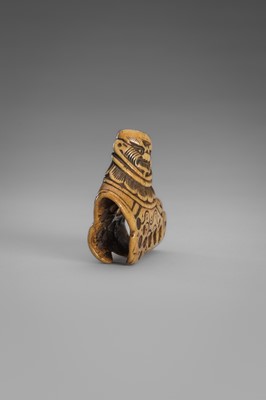Lot 459 - A FINE ANTLER ‘SILK SEAL’ NETSUKE OF A FOREIGNER
