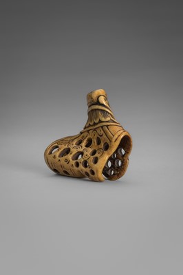 Lot 459 - A FINE ANTLER ‘SILK SEAL’ NETSUKE OF A FOREIGNER