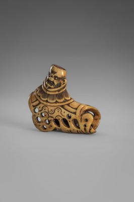 Lot 459 - A FINE ANTLER ‘SILK SEAL’ NETSUKE OF A FOREIGNER