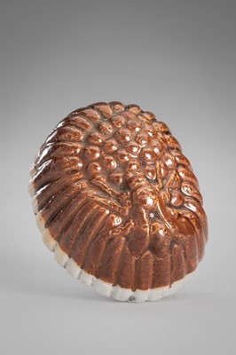 Lot 1778 - A RARE PORCELAIN (YAKIMONO) NETSUKE OF A WASP ON A WASP NEST