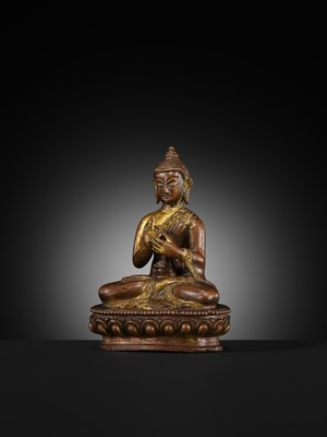 A SMALL PARCEL-GILT COPPER ALLOY FIGURE OF BUDDHA, TIBET OR NEPAL, 17TH-18TH CENTURY