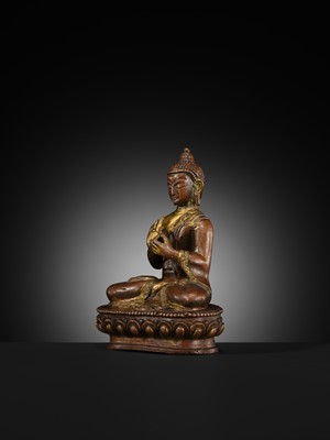 A SMALL PARCEL-GILT COPPER ALLOY FIGURE OF BUDDHA, TIBET OR NEPAL, 17TH-18TH CENTURY