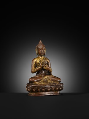 A SMALL PARCEL-GILT COPPER ALLOY FIGURE OF BUDDHA, TIBET OR NEPAL, 17TH-18TH CENTURY
