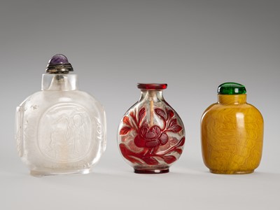 Lot 1052 - A GROUP OF THREE GLASS AND ROCK CRYSTAL SNUFF BOTTLES, QING DYNASTY