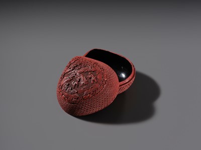 Lot 115 - A CINNABAR LACQUER PEACH-FORM BOX AND COVER DEPICTING SHOULAO, 18TH CENTURY