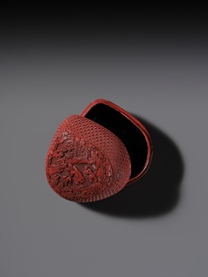 Lot 115 - A CINNABAR LACQUER PEACH-FORM BOX AND COVER DEPICTING SHOULAO, 18TH CENTURY