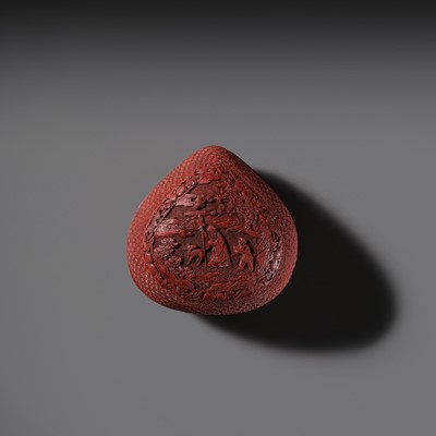 Lot 115 - A CINNABAR LACQUER PEACH-FORM BOX AND COVER DEPICTING SHOULAO, 18TH CENTURY