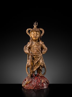 A RED AND GILT-LACQUERED BRONZE FIGURE OF WEITUO PUSA, MING DYNASTY