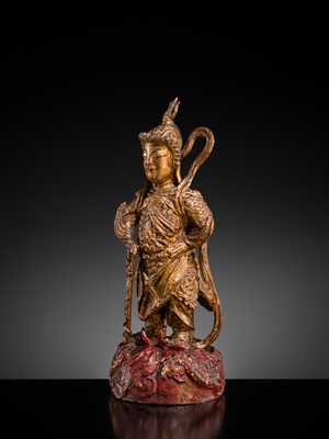 A RED AND GILT-LACQUERED BRONZE FIGURE OF WEITUO PUSA, MING DYNASTY
