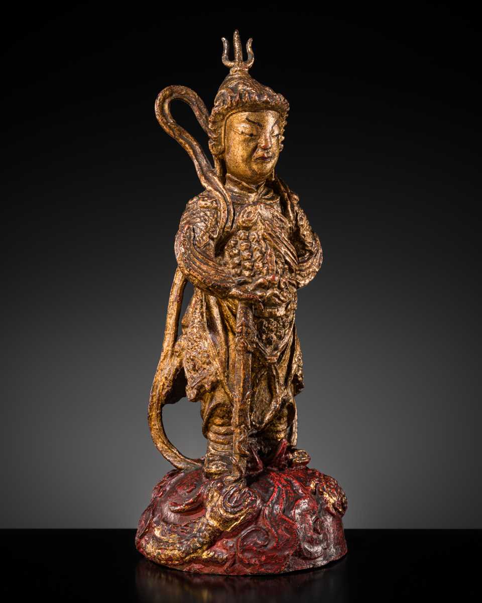 A RED AND GILT-LACQUERED BRONZE FIGURE OF WEITUO PUSA, MING DYNASTY