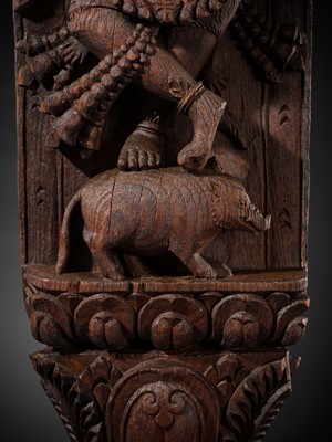 A WOOD STRUT DEPICTING THE FOUR-ARMED BHAIRAVA ATOP A BOAR, NEPAL, 17TH-18TH CENTURY