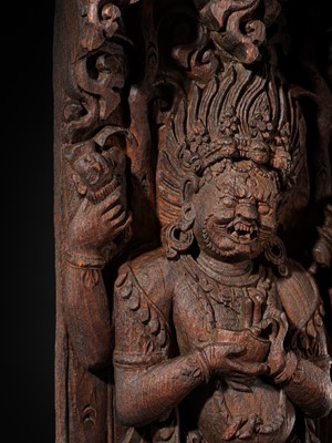 A WOOD STRUT DEPICTING THE FOUR-ARMED BHAIRAVA ATOP A BOAR, NEPAL, 17TH-18TH CENTURY