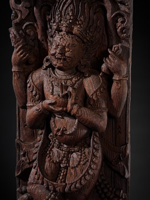 A WOOD STRUT DEPICTING THE FOUR-ARMED BHAIRAVA ATOP A BOAR, NEPAL, 17TH-18TH CENTURY