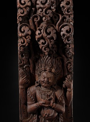 A WOOD STRUT DEPICTING THE FOUR-ARMED BHAIRAVA ATOP A BOAR, NEPAL, 17TH-18TH CENTURY