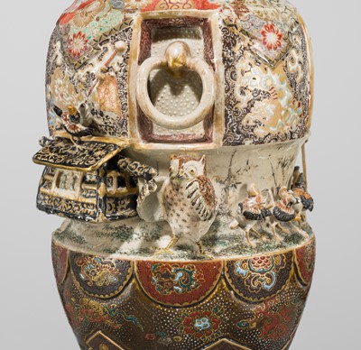 MAKUZU KOZAN: A GROUP OF FOUR LARGE MOLDED, GILT-DECORATED AND ENAMELED EARTHENWARE VASES WITH FROLICKING ANIMALS