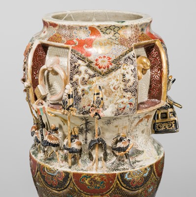 MAKUZU KOZAN: A GROUP OF FOUR LARGE MOLDED, GILT-DECORATED AND ENAMELED EARTHENWARE VASES WITH FROLICKING ANIMALS