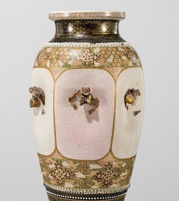 MAKUZU KOZAN: A GROUP OF FOUR LARGE MOLDED, GILT-DECORATED AND ENAMELED EARTHENWARE VASES WITH FROLICKING ANIMALS