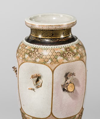 MAKUZU KOZAN: A GROUP OF FOUR LARGE MOLDED, GILT-DECORATED AND ENAMELED EARTHENWARE VASES WITH FROLICKING ANIMALS