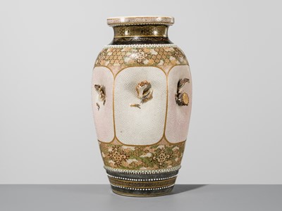 MAKUZU KOZAN: A GROUP OF FOUR LARGE MOLDED, GILT-DECORATED AND ENAMELED EARTHENWARE VASES WITH FROLICKING ANIMALS