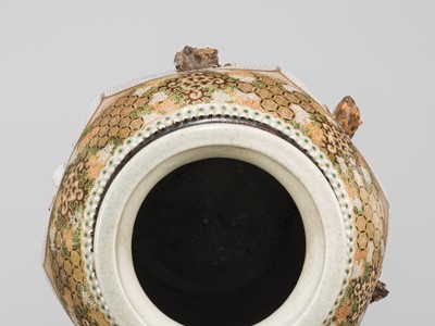 MAKUZU KOZAN: A GROUP OF FOUR LARGE MOLDED, GILT-DECORATED AND ENAMELED EARTHENWARE VASES WITH FROLICKING ANIMALS