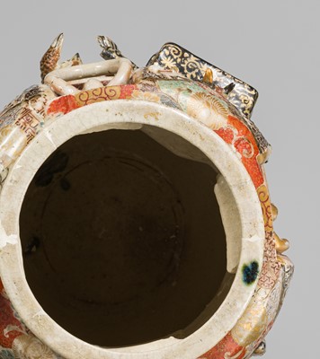 MAKUZU KOZAN: A GROUP OF FOUR LARGE MOLDED, GILT-DECORATED AND ENAMELED EARTHENWARE VASES WITH FROLICKING ANIMALS