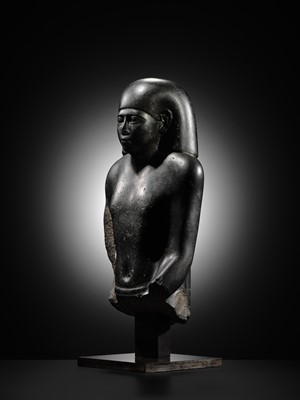 Lot 10 - AN IMPORTANT AND INSCRIBED BASALT BUST OF THE PRIEST AMUN PA-KHAR-KHONSU, PROPHET OF UASET THE VICTORIOUS, THEBES, EARLY PTOLEMAIC PERIOD