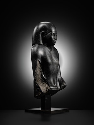 Lot 10 - AN IMPORTANT AND INSCRIBED BASALT BUST OF THE PRIEST AMUN PA-KHAR-KHONSU, PROPHET OF UASET THE VICTORIOUS, THEBES, EARLY PTOLEMAIC PERIOD