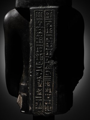 Lot 10 - AN IMPORTANT AND INSCRIBED BASALT BUST OF THE PRIEST AMUN PA-KHAR-KHONSU, PROPHET OF UASET THE VICTORIOUS, THEBES, EARLY PTOLEMAIC PERIOD