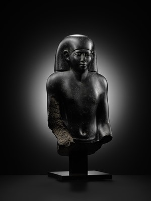 Lot 10 - AN IMPORTANT AND INSCRIBED BASALT BUST OF THE PRIEST AMUN PA-KHAR-KHONSU, PROPHET OF UASET THE VICTORIOUS, THEBES, EARLY PTOLEMAIC PERIOD
