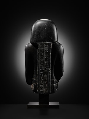 Lot 10 - AN IMPORTANT AND INSCRIBED BASALT BUST OF THE PRIEST AMUN PA-KHAR-KHONSU, PROPHET OF UASET THE VICTORIOUS, THEBES, EARLY PTOLEMAIC PERIOD