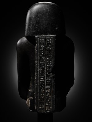 Lot 10 - AN IMPORTANT AND INSCRIBED BASALT BUST OF THE PRIEST AMUN PA-KHAR-KHONSU, PROPHET OF UASET THE VICTORIOUS, THEBES, EARLY PTOLEMAIC PERIOD