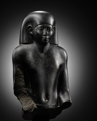 Lot 10 - AN IMPORTANT AND INSCRIBED BASALT BUST OF THE PRIEST AMUN PA-KHAR-KHONSU, PROPHET OF UASET THE VICTORIOUS, THEBES, EARLY PTOLEMAIC PERIOD