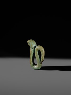 Lot 47 - A RARE URAEUS AMULET OF WADJET AND NEKHBET, TURQUOISE-BLUE FAIENCE, LATE PERIOD
