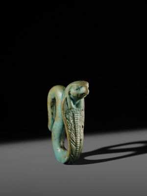 Lot 47 - A RARE URAEUS AMULET OF WADJET AND NEKHBET, TURQUOISE-BLUE FAIENCE, LATE PERIOD