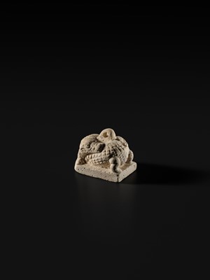 Lot 44 - A WHITE LIMESTONE AMULET OF SOBEK, PTOLEMAIC PERIOD