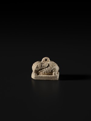 Lot 44 - A WHITE LIMESTONE AMULET OF SOBEK, PTOLEMAIC PERIOD