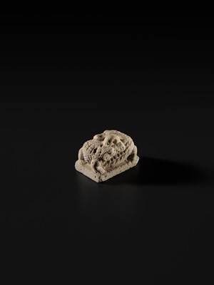 Lot 44 - A WHITE LIMESTONE AMULET OF SOBEK, PTOLEMAIC PERIOD